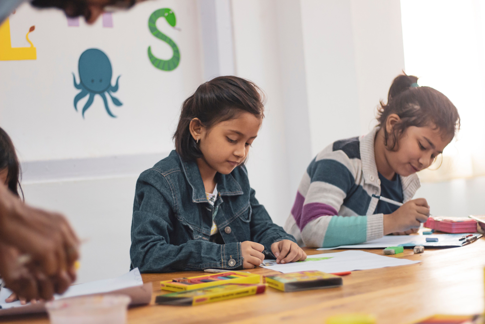 Indian children engaged in drawing and creative classroom activities